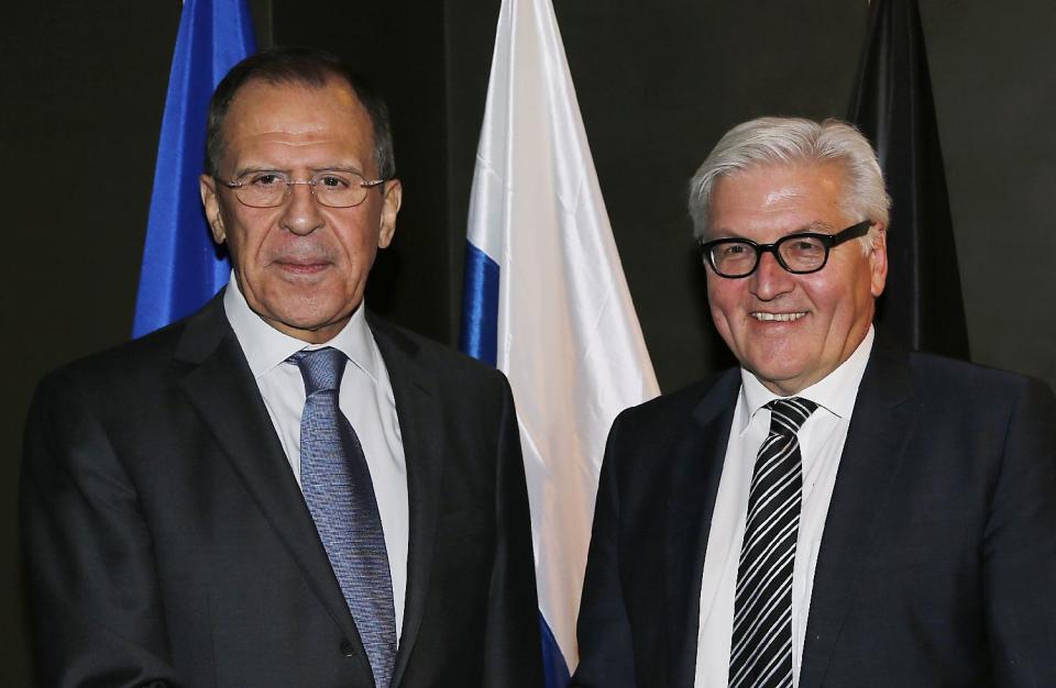 German Foreign Minister Frank-Walter Steinmeier , right, meets Russian Minister of Foreign Affairs, Sergey Lavrov, during the 50th Security Conference in Munich, Germany, Friday, Jan. 31, 2014. The conference on security policy takes place from Jan. 31, 2014 until Feb 2, 2014. (AP Photo/Frank Augstein)