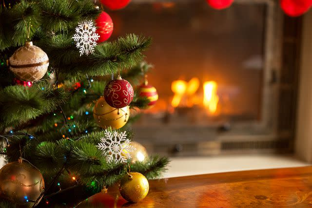 <p>Artfoliophoto/Getty</p> Christmas tree in living room.