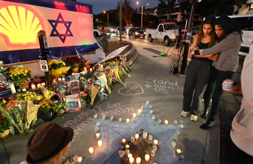Thousand Oaks, California November 7, 2023-Avia Jacobs, left, and her mother Sharona pay their respects to Paul Kessler , a Jewish supporter, who died after being struck by a Palestinian protestor at the corner of Westlake Blvd. and Thousand Oaks Blvd. in Thousand Oaks. (Wally Skalij/Los Angeles Times)