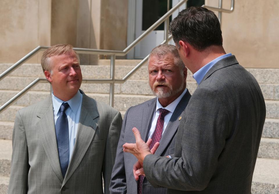 Oklahoma County Commissioner Brian Maughan, left, speaks with Ward 4 Councilman Todd Stone and Mayor David Holt about the expansion of Tinker Air Force Base on  July 22, 2021.