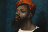 Detail of a painting by Jan Mostaert, titled Portrait of an African Man, painted around 1525-1530, during a press preview of the Remember Me exhibit which brings together international masterpieces of portraiture at the Rijksmuseum in Amsterdam, Netherlands, Tuesday, Sept. 28, 2021. As COVID-19 lockdowns ease and borders reopen, there is a gathering at Amsterdam's Rijksmuseum of people from around Europe, depicted in more than 100 Renaissance portraits. The Dutch national museum's new exhibition “Remember Me,” covers the century 1470-1570. (AP Photo/Peter Dejong)