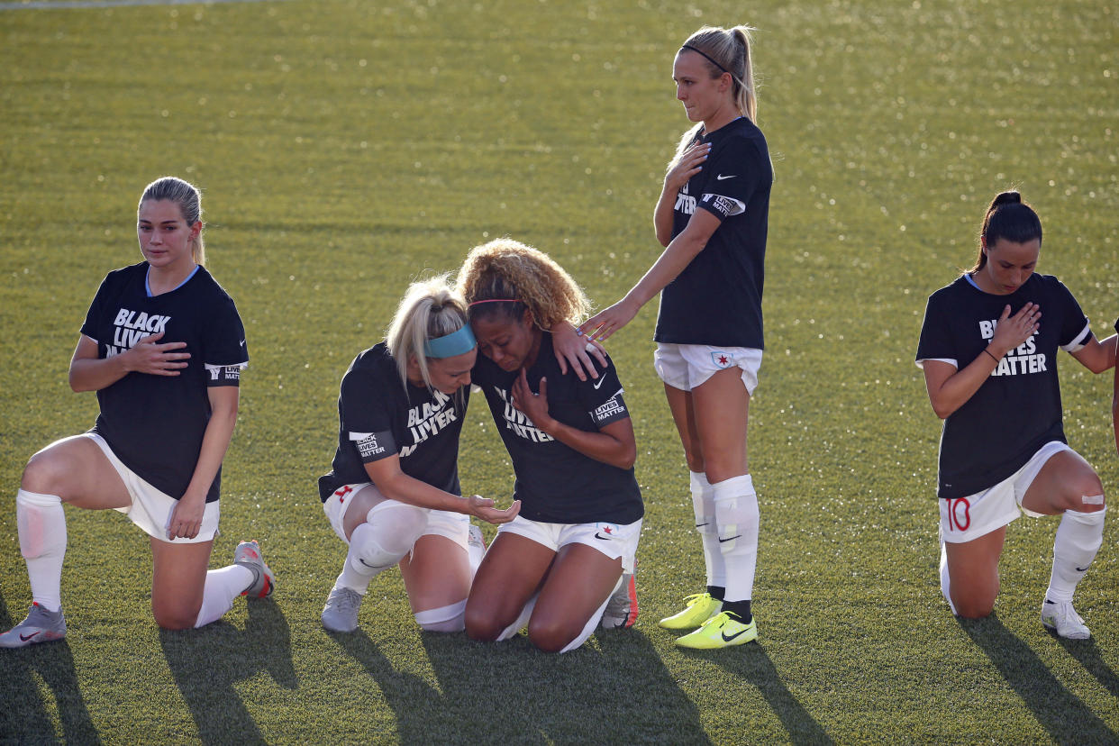 Chicago Red Stars players Casey Short and Julie Ertz broke their silence about the emotional moment they shared during the national anthem on Saturday. (AP Photo/Rick Bowmer)