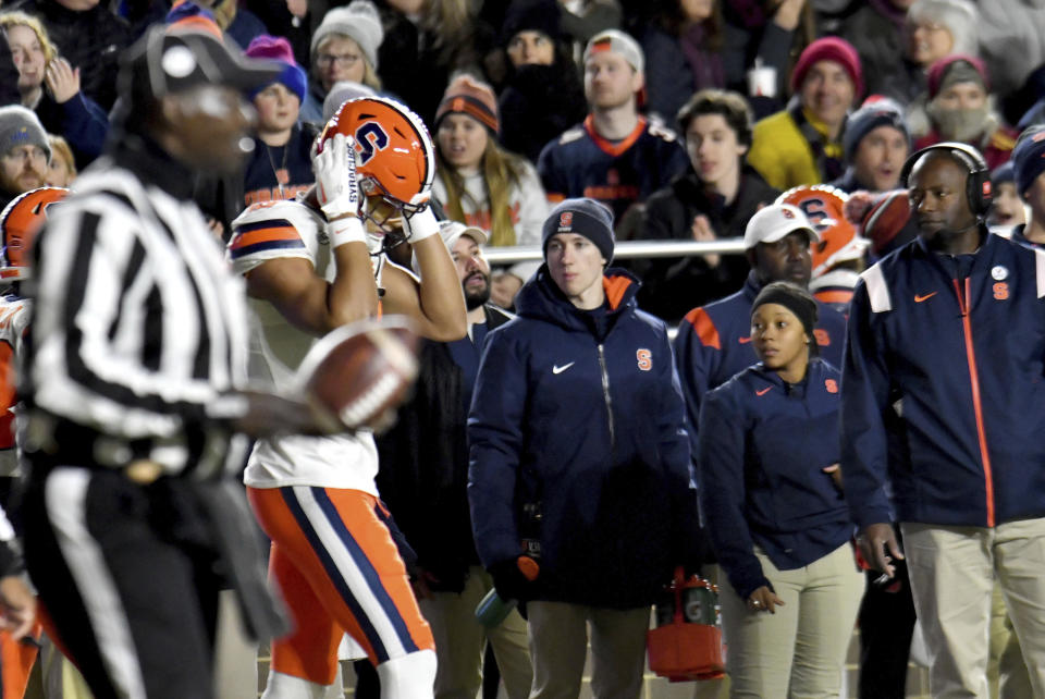 Syracuse's Oronde Gadsen, second from left, reacts after his touchdown catch in the end zone was overturned due to an offensive line penalty during the first half of an NCAA college football game against Boston College, Saturday, Nov. 26, 2022, in Boston. (AP Photo/Mark Stockwell)