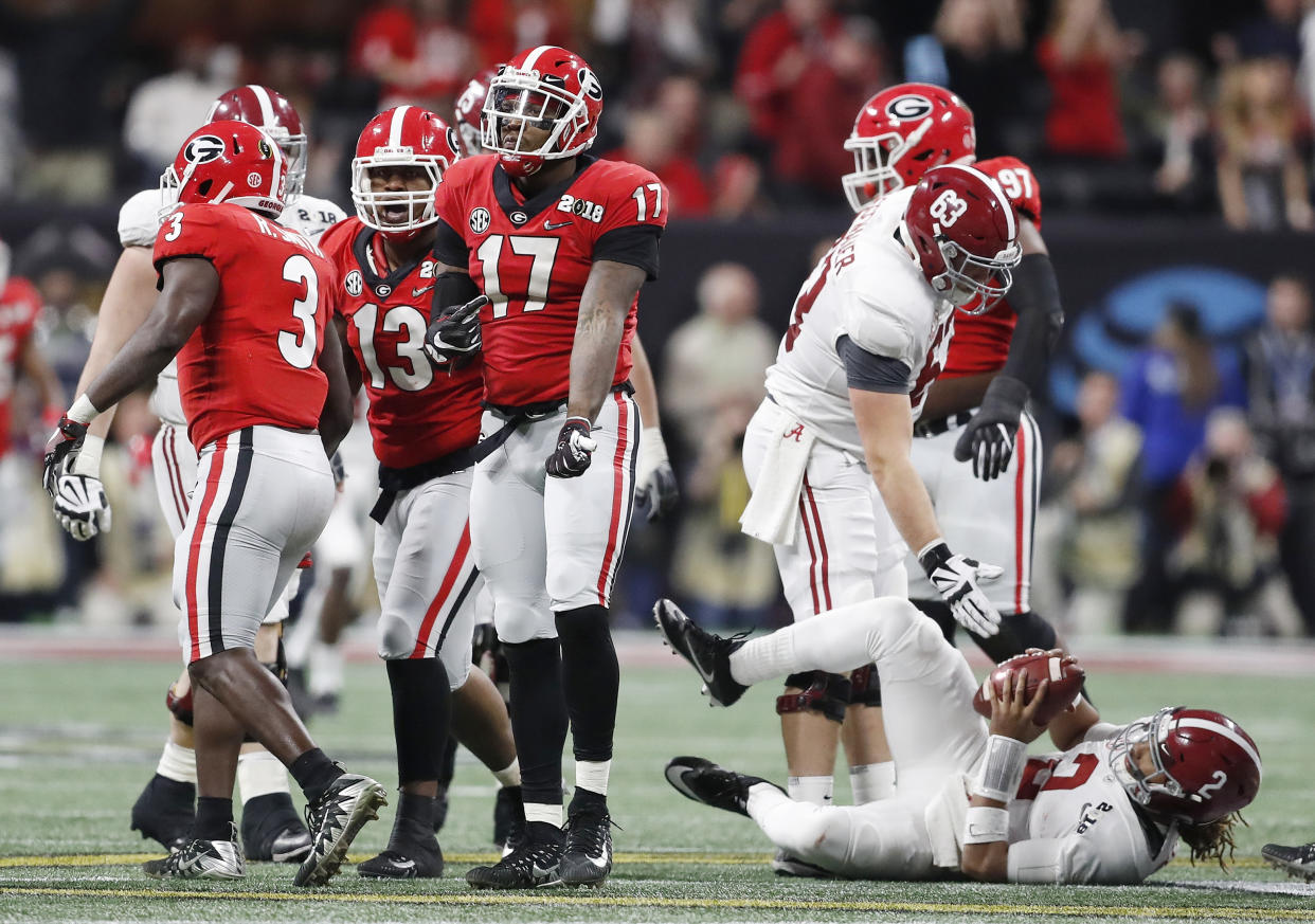 Georgia’s Davin Bellamy celebrates after sacking Alabama quarterback Jalen Hurts (2) during the first half of the NCAA college football playoff championship game Monday, Jan. 8, 2018, in Atlanta. (AP Photo/David Goldman)