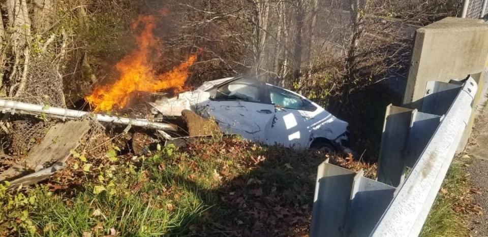 Two passersby in Raynham help a young man escape from his burning vehicle after a car crash on Route 24.