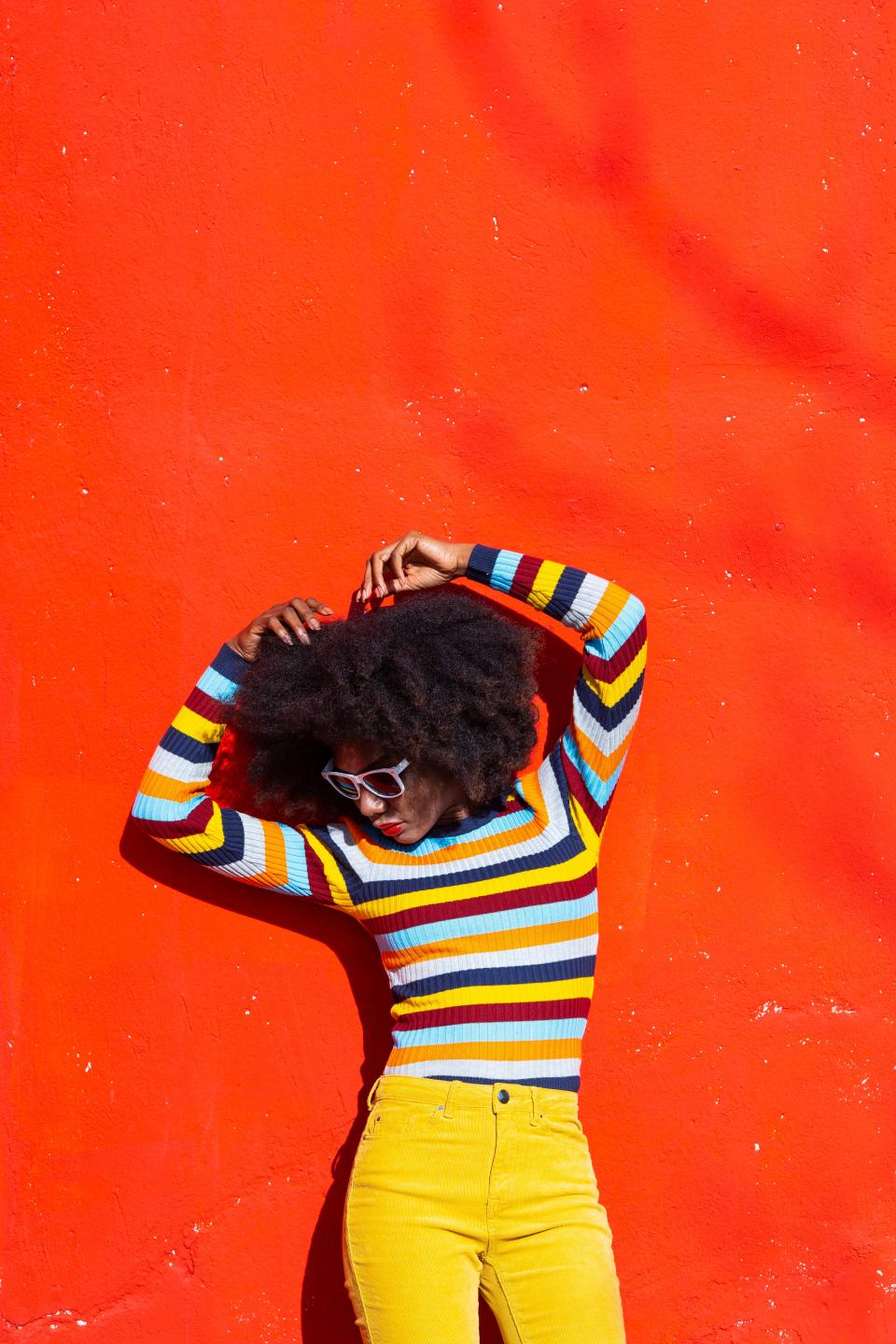 <h1 class="title">Portrait of a Afro woman on colorful background</h1><cite class="credit">Getty Images</cite>