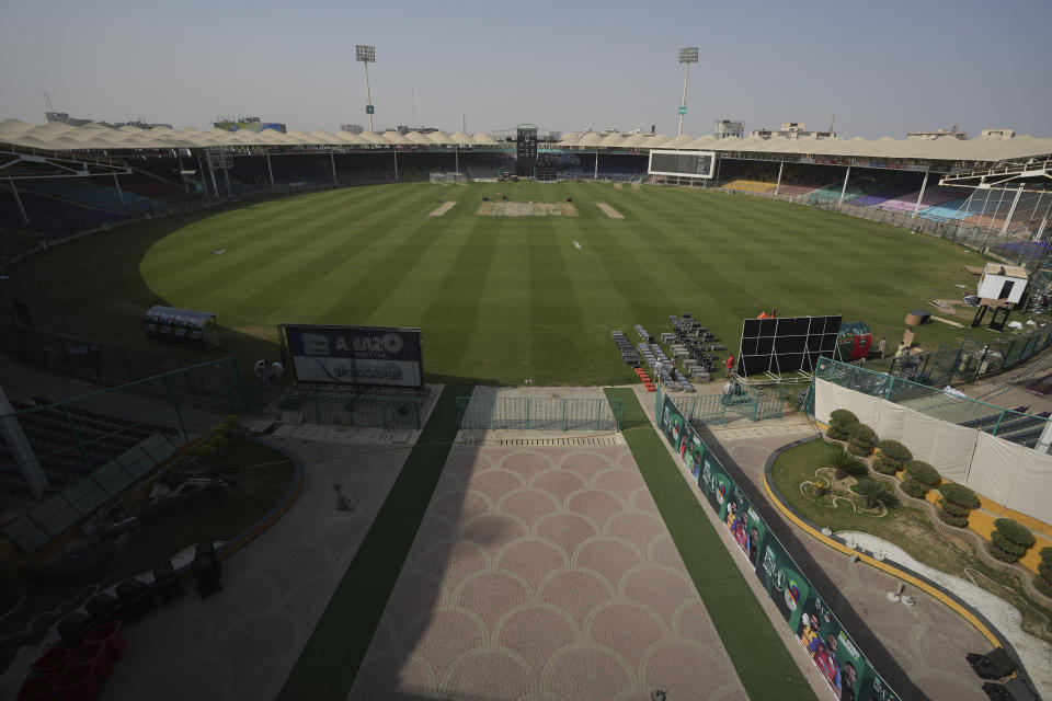 Workers give final touches of arrangements at the National Stadium for upcoming Pakistan Super League, in Karachi, Pakistan, Saturday, Feb. 11, 2023. Karachi will host the first leg of nine matches of Pakistan Super League Twenty20 cricket tournament, beginning from Monday. (AP Photo/Fareed Khan)