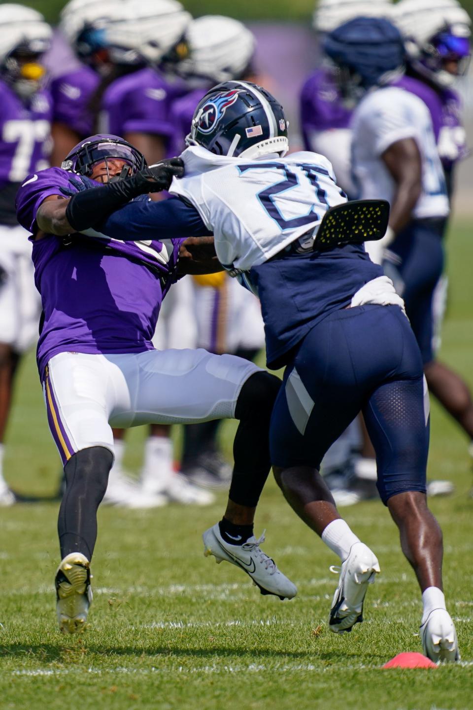 Tennessee Titans safety A.J. Moore Jr. (20) knocks down Minnesota Vikings safety Jay Ward (20) during a joint practice with the Minnesota Vikings in Eagan, Minn., Thursday, Aug. 17, 2023.