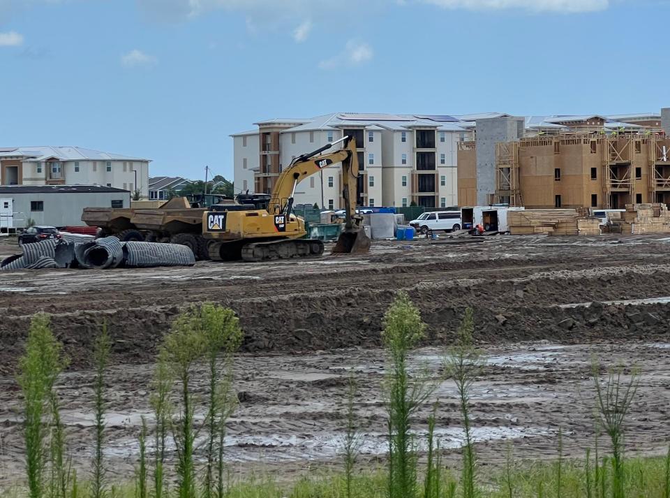 The city of Daytona Beach has spent $1.5 million of its federal COVID recovery funds on a roof replacement program to help preserve affordable housing. Pictured is a construction crew clearing land next to the Clyde Morris Landing affordable apartment and senior housing complex as it was being built out at 1381 N. Clyde Morris Blvd., a mile south of LPGA Boulevard, in Daytona Beach in July 2022.