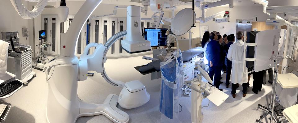 People gather for photos inside one of the operating suites inside the new $20 million cardiac and vascular center at Ocean University Medical Center in Brick Friday afternoon, March 24, 2023.   