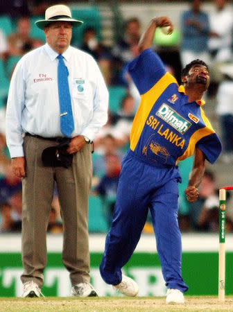 FILE PHOTO: Australian Umpire Darrell Hair watches Sri Lanka's Muttiah Muralitharan bowl during a one day match against England at the Sydney Cricket Ground, January 13, 2003. REUTERS/Tim Wimborne/File Photo