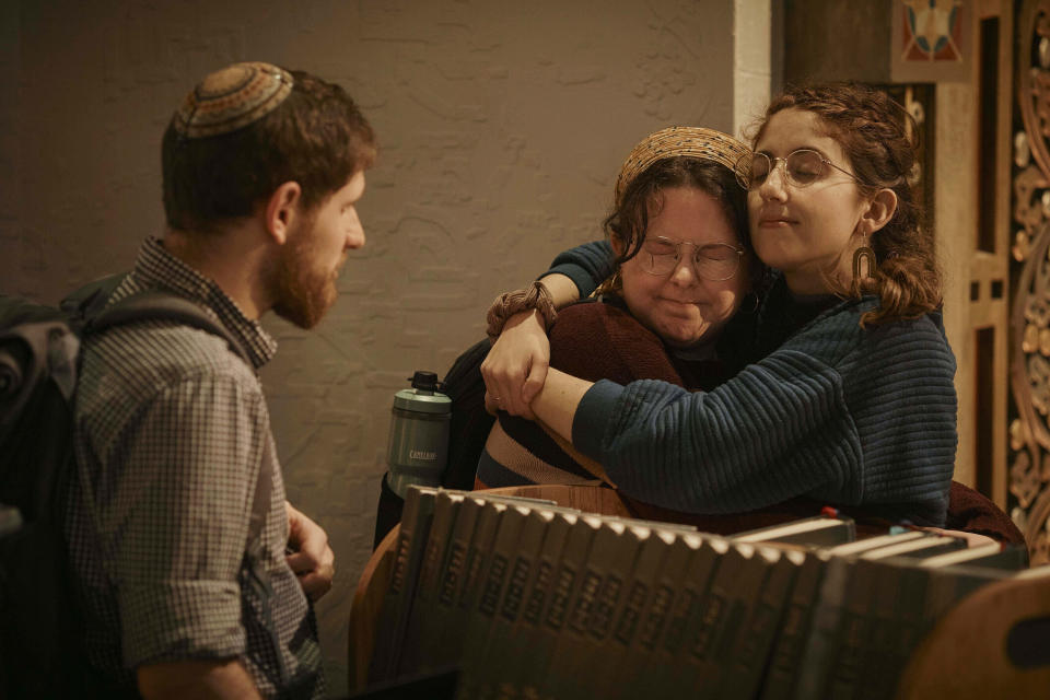 Jews hug after a communal prayer to honor and offer support for the victims in Israel at B'nai Jeshurun Synagogue on Thursday, Oct. 12, 2023, in New York. (AP Photo/Andres Kudacki)