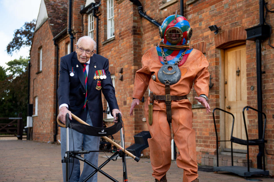 EMBARGOED TO 0001 FRIDAY SEPTEMBER 25 Captain Sir Tom Moore in Marston Moretaine, Bedford with veteran fundraiser Lloyd Scott, who will attempt to climb the Three Peaks whilst wearing a deep sea diving suit.