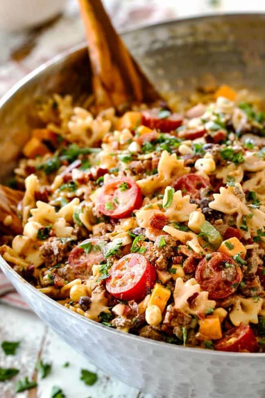 <p>Carlsbad Cravings</p><p>This cowboy pasta salad is a TexMex pasta salad at it’s most tantalizing. It is fully loaded with everything delicious and makes not only a crowd pleasing potluck side but is a stand-alone dinner as well.</p><p><strong>Get the recipe: <a href="https://carlsbadcravings.com/cowboy-pasta-salad/" rel="nofollow noopener" target="_blank" data-ylk="slk:Cowboy Pasta Salad;elm:context_link;itc:0;sec:content-canvas" class="link ">Cowboy Pasta Salad</a></strong></p>