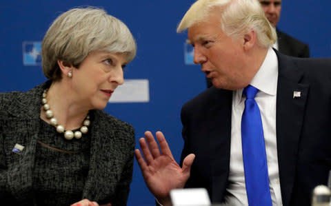 Donald Trump, right, and Theresa May - Credit: MATT DUNHAM/AFP/Getty Images