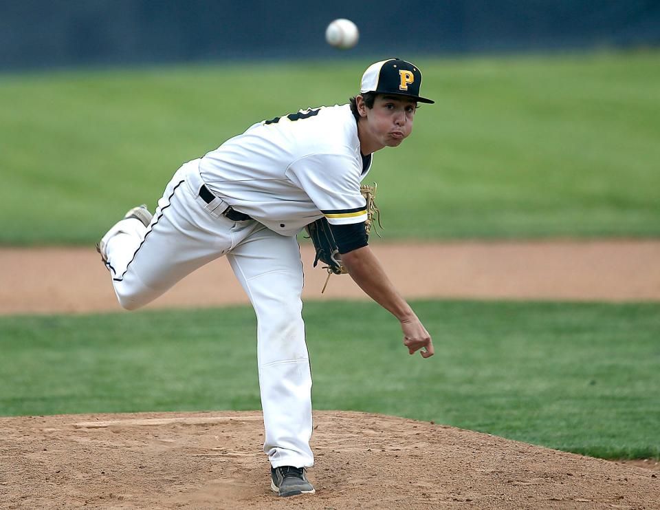 Black River High School's Hunter McJunkins (12) delivers a pitch in the first inning against Elyria Catholic High School during their OHSAA Division III district semifinal baseball game at Copley High School on Monday, May 23, 2022. TOM E. PUSKAR/TIMES-GAZETTE.COM