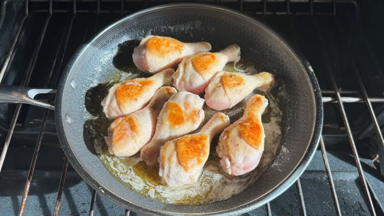 chicken in pan in oven