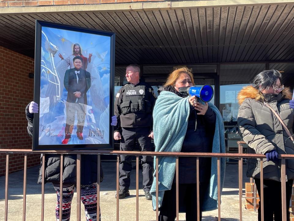 Sarita Guzman, Irving's mother, fights through tears to lead the crowd in chants for justice in front of Pleasantville City Hall.