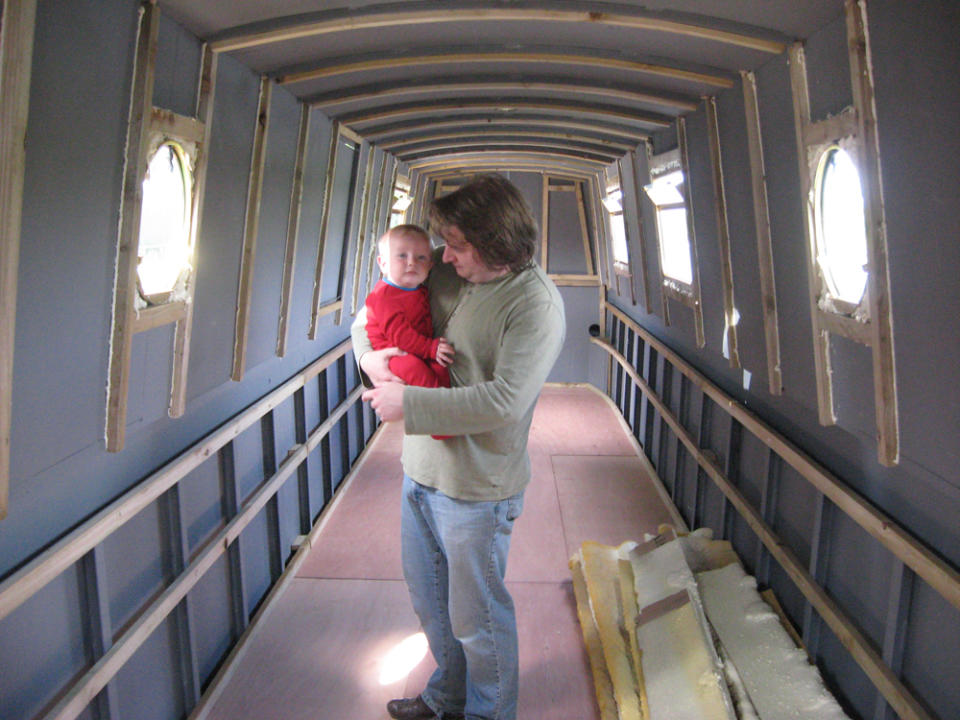 Matt and their son in their new narrowboat in 2010 (Collect/PA Real Life)