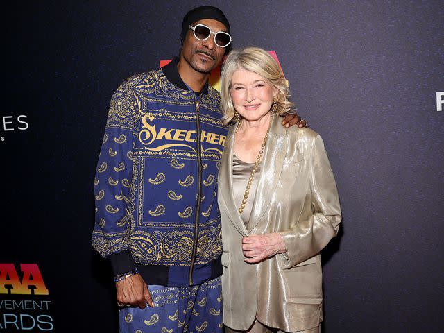 <p>Jamie McCarthy/Footwear News via Getty</p> Snoop Dogg and Martha Stewart attend the 2023 Footwear News Achievement Awards at Cipriani South Street on November 29, 2023 in New York City.