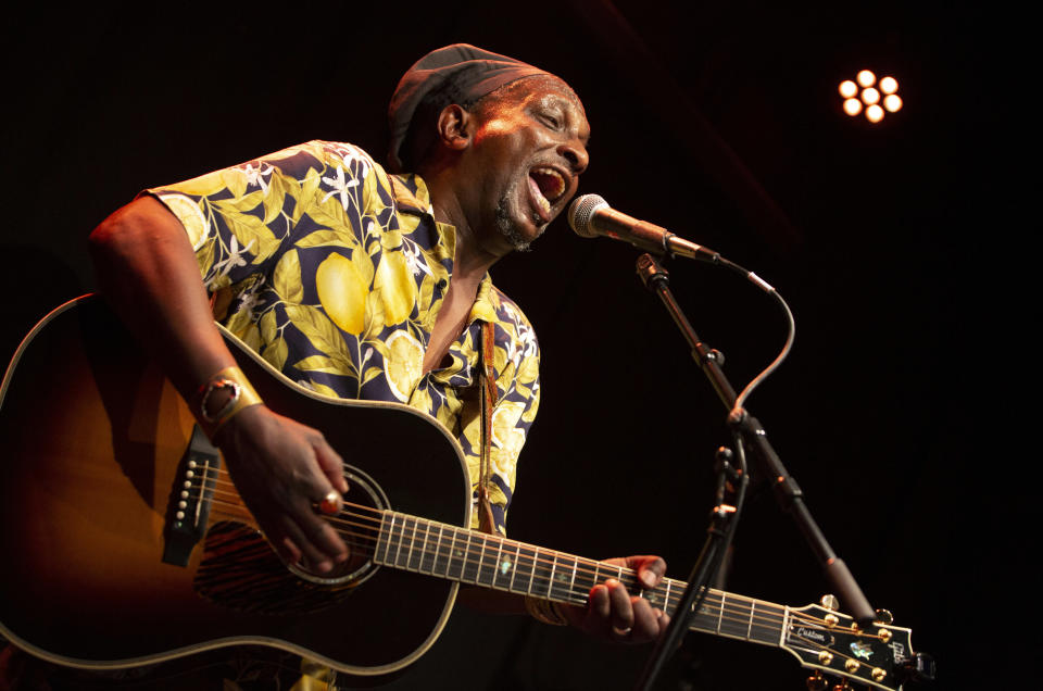 In this photo taken on Monday, June 22, 2020, Eric Baranyanka practices with his band at a recording studio in Edegem, Baranyanka fled political persecution in the Belgian protectorate of Burundi in the 1960's, landing half a world away at a military airport in Brussels, before being fostered by Emma Monsaert and her husband Paul in Lembeeke, Belgium. (AP Photo/Virginia Mayo)