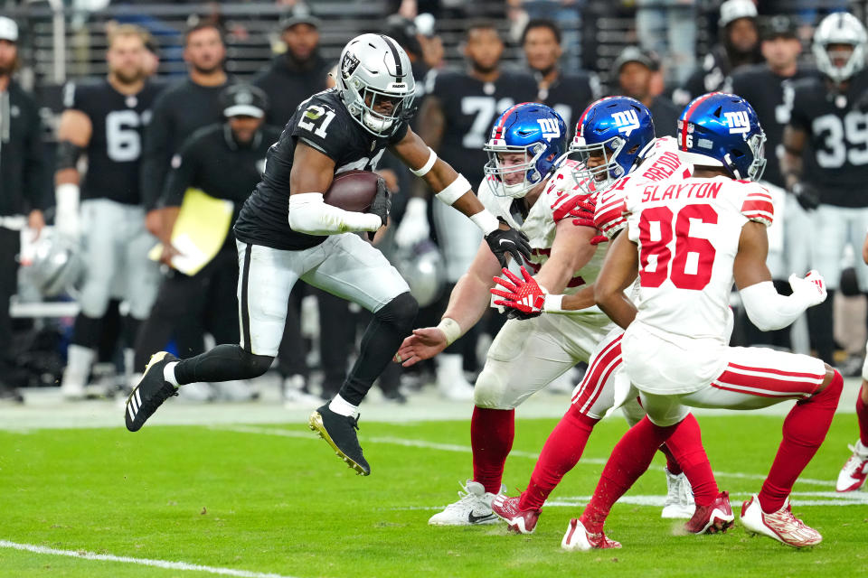Nov 5, 2023; Paradise, Nevada, USA; Las Vegas Raiders cornerback Amik Robertson (21) eludes a tackle after making an interception against the New York Giants during the second quarter at Allegiant Stadium. Mandatory Credit: Stephen R. Sylvanie-USA TODAY Sports