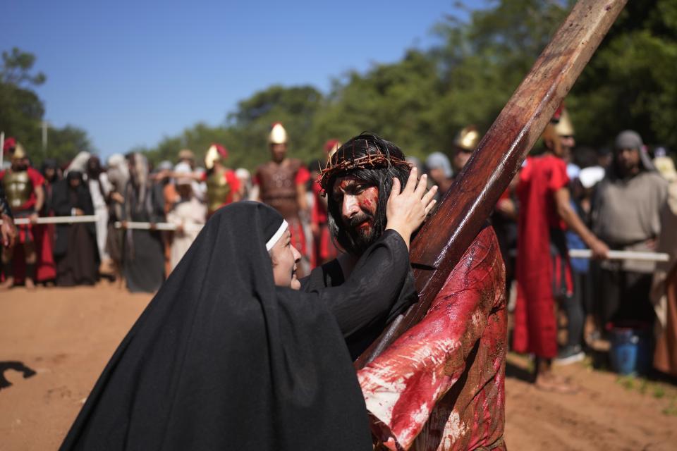 Actors perform in a Way of the Cross reenactment as part of Holy Week celebrations, in Atyra, Paraguay, Friday, March 29, 2024. Holy Week commemorates the last week of Jesus Christ’s earthly life which culminates with his crucifixion on Good Friday and his resurrection on Easter Sunday. (AP Photo/Jorge Saenz)