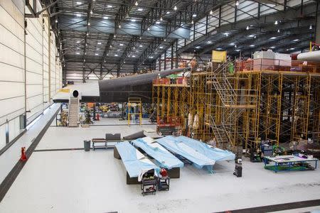 Vulcan Aerospace's Stratolaunch rockets' left fuselage assembly is shown under construction by Northrop Grumann Scaled Composites at the Mojave Air and Space Port in Mojave, California, U.S. in this handout photo released to Reuters June 19, 2016. Vulcan Industries/Handout via Reuters