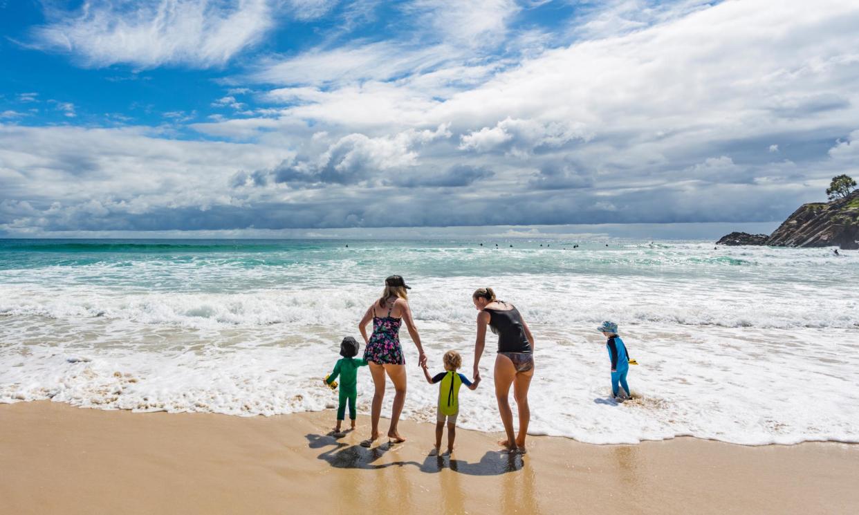 <span>Cheap, inclusive and accessible activities, such as trips to the beach, are a great way to create connection with other single parents and their children.</span><span>Photograph: davidf/Getty Images</span>