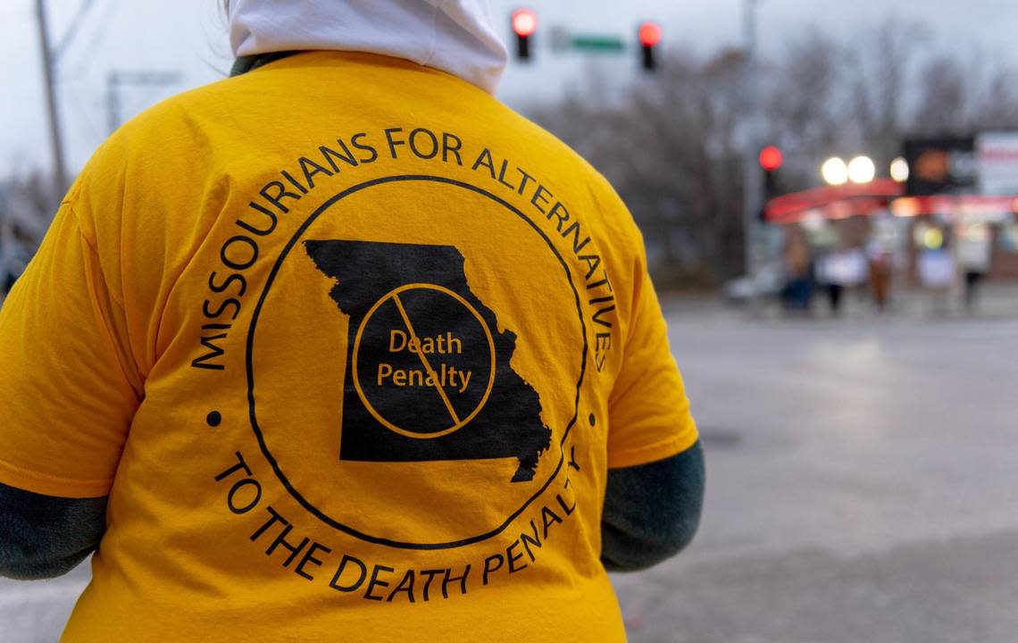 People protest the planned execution of Missouri inmate Kevin Johnson on Tuesday, Nov. 29, 2022, in Kansas City.