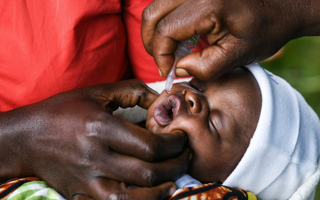 A baby in Lilongwe receives an oral polio vaccine during Malawi's Polio Vaccination Campaign Launch - Thoko Chikondi/AP