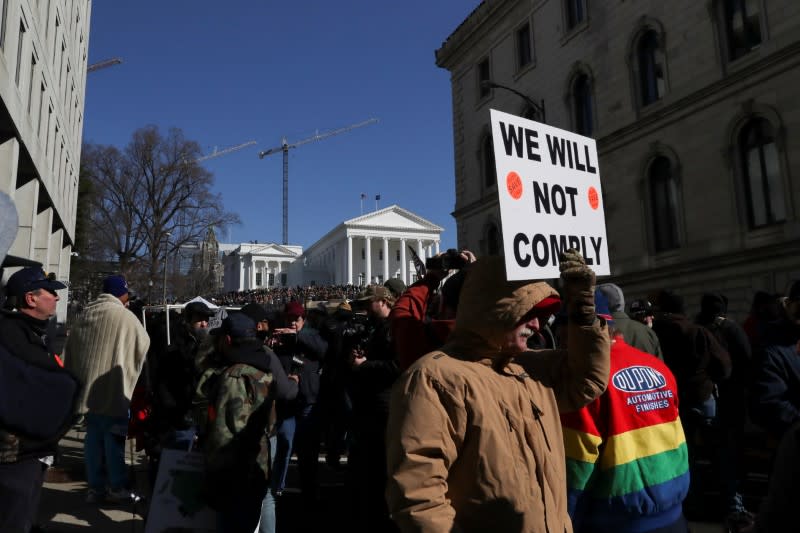 People take part in a rally against the Virginia Democrats' plan to pass gun legislation, at the Virginia State Capitol building, in Richmond