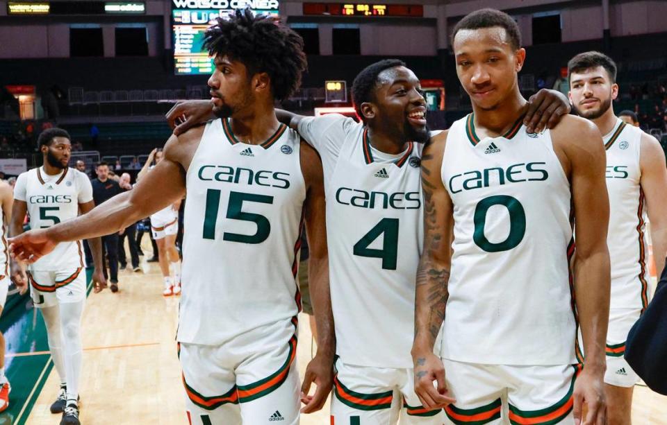 Miami Hurricanes forward Norchad Omier (15) guard Bensley Joseph (4) and guard Matthew Cleveland (0) react after the win against the La Salle Explorers at an NCAA basketball game at the Watsco Center in Coral Gables, Florida on Saturday, December 16, 2023.