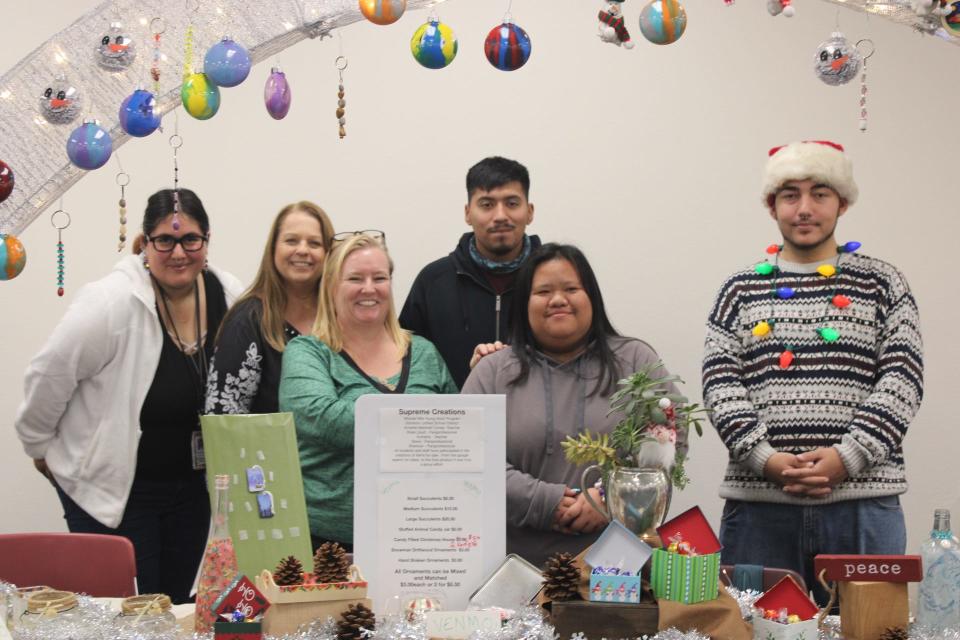 Teacher Annette Marshall Correa, paraprofessional Rose Lloyd, and students from Stockton Unified's Miracle Mile Young Adult Program participated in the eighth annual Holiday Boutique at San Joaquin County Office of Education on Thursday, Dec. 7, 2023.