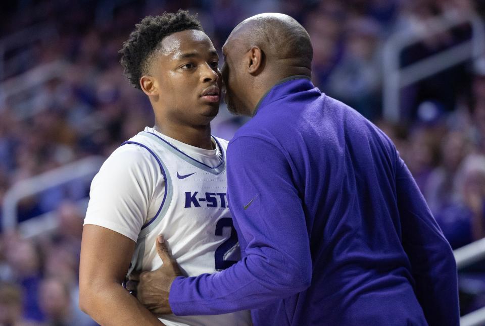 Kansas State guard Tylor Perry gets advice from assistant coach Rodney Perry during the second half of the team's NCAA college basketball game against Central Florida on Saturday, Jan. 6, 2024, in Manhattan, Kan. (AP Photo/Travis Heying)
