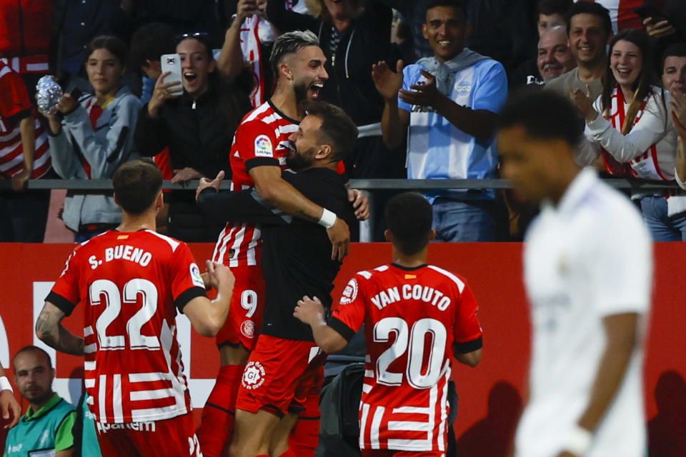 Girona's Taty Castellanos celebrates with teammates after scoring his side's opening goal during a Spanish La Liga soccer match between Girona and Real Madrid, at the Montilivi stadium in Girona, Spain, Tuesday, April 25, 2023. (AP Photo/Joan Monfort)