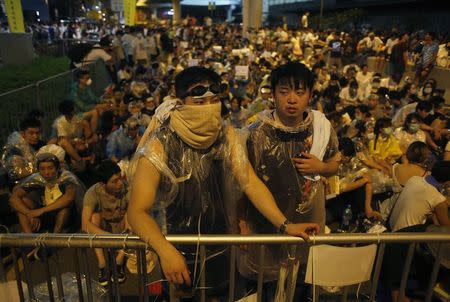 Protesters take part in an evening rally attended by thousands in front of the government headquarters in Hong Kong September 27, 2014. REUTERS/Bobby Yip