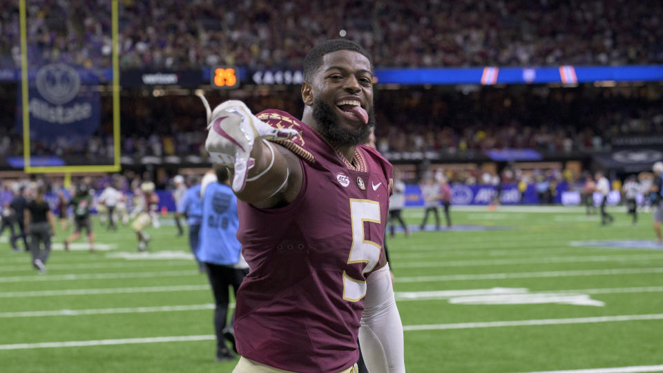 FILE - Florida State defensive lineman Jared Verse (5) celebrates his team's 24-23 victory over LSU in an NCAA football game on Saturday, Sept. 4, 2022, in New Orleans. Verse was selected the top first-year transfer in the Associated Press ACC Midseason Awards, Wednesday, Oct. 12, 2022.(AP Photo/Matthew Hinton, File)