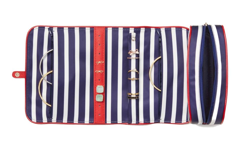 <p>This nautical striped roll has plenty of storage for your accessories and <a rel="nofollow noopener" href="http://www.travelandleisure.com/style/beauty/best-summer-beauty-products" target="_blank" data-ylk="slk:beauty essentials for a weekend at the beach;elm:context_link;itc:0;sec:content-canvas" class="link ">beauty essentials for a weekend at the beach</a>.</p> <p>To buy: <a rel="nofollow noopener" href="http://www.pntrs.com/t/2-98488-131940-47657?sid=TLTRVG1JewelryCasesDZJun17&website=250357&url=https%3A%2F%2Fwww.katespade.com%2Fproducts%2Fclassic-nylon-jewelry-roll%2F098689987613.html" target="_blank" data-ylk="slk:katespade.com;elm:context_link;itc:0;sec:content-canvas" class="link ">katespade.com</a>, $78</p>