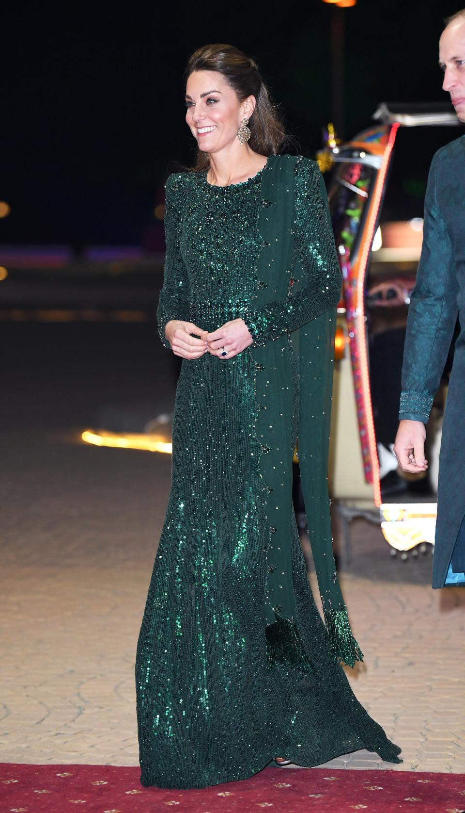 Kate Middleton and Prince William arrived in coordinating outfits at <a href="https://people.com/royals/kate-middleton-and-prince-william-just-had-their-most-glam-moment-in-pakistan-in-a-rickshaw/" rel="nofollow noopener" target="_blank" data-ylk="slk:a special reception in their honor in Pakistan;elm:context_link;itc:0;sec:content-canvas" class="link ">a special reception in their honor in Pakistan</a>. Kate looked radiant in a sparkling deep emerald column gown by Jenny Packham and a pair of statement earrings by Onitaa, which are sourced from Pakistan. <strong>Get the Look!</strong> Club L London Sequin Open Back Fishtail Maxi Dress in Emerald Green, $135; <a href="https://click.linksynergy.com/deeplink?id=93xLBvPhAeE&mid=35719&murl=https%3A%2F%2Fwww.asos.com%2Fus%2Fclub-l-london%2Fclub-l-london-sequin-open-back-fishtail-maxi-dress-in-emerald-green%2Fprd%2F13531054&u1=PEO%2CShopping%3AEverythingYouNeedtoCopyKateMiddleton%E2%80%99sChicWinterStyle%2Ckamiphillips2%2CUnc%2CGal%2C7360903%2C202002%2CI" rel="nofollow noopener" target="_blank" data-ylk="slk:asos.com;elm:context_link;itc:0;sec:content-canvas" class="link ">asos.com</a> Tahari Embellished Lace Gown, $228; <a href="https://click.linksynergy.com/deeplink?id=93xLBvPhAeE&mid=1237&murl=https%3A%2F%2Fshop.nordstrom.com%2Fs%2Ftahari-embellished-lace-gown%2F5375902&u1=PEO%2CShopping%3AEverythingYouNeedtoCopyKateMiddleton%E2%80%99sChicWinterStyle%2Ckamiphillips2%2CUnc%2CGal%2C7360903%2C202002%2CI" rel="nofollow noopener" target="_blank" data-ylk="slk:nordstrom.com;elm:context_link;itc:0;sec:content-canvas" class="link ">nordstrom.com</a> XSCAPE Sequined Gown, $216.75 with code THANKS (orig. $289); <a href="https://click.linksynergy.com/deeplink?id=93xLBvPhAeE&mid=3184&murl=https%3A%2F%2Fwww.macys.com%2Fshop%2Fproduct%2Fxscape-sequined-gown%3FID%3D10043715&u1=PEO%2CShopping%3AEverythingYouNeedtoCopyKateMiddleton%E2%80%99sChicWinterStyle%2Ckamiphillips2%2CUnc%2CGal%2C7360903%2C202002%2CI" rel="nofollow noopener" target="_blank" data-ylk="slk:macys.com;elm:context_link;itc:0;sec:content-canvas" class="link ">macys.com</a> Adrianna Papell Beaded Blouson Gown, $209; <a href="https://click.linksynergy.com/deeplink?id=93xLBvPhAeE&mid=13867&murl=https%3A%2F%2Fwww.bloomingdales.com%2Fshop%2Fproduct%2Fadrianna-papell-beaded-blouson-gown%3FID%3D1543390&u1=PEO%2CShopping%3AEverythingYouNeedtoCopyKateMiddleton%E2%80%99sChicWinterStyle%2Ckamiphillips2%2CUnc%2CGal%2C7360903%2C202002%2CI" rel="nofollow noopener" target="_blank" data-ylk="slk:bloomingdales.com;elm:context_link;itc:0;sec:content-canvas" class="link ">bloomingdales.com</a> Dress the Population Natalie Sequin Long Sleeve Body-Con Dress, $264; <a href="https://click.linksynergy.com/deeplink?id=93xLBvPhAeE&mid=1237&murl=https%3A%2F%2Fshop.nordstrom.com%2Fs%2Fdress-the-population-natalie-sequin-long-sleeve-body-con-dress%2F5447718&u1=PEO%2CShopping%3AEverythingYouNeedtoCopyKateMiddleton%E2%80%99sChicWinterStyle%2Ckamiphillips2%2CUnc%2CGal%2C7360903%2C202002%2CI" rel="nofollow noopener" target="_blank" data-ylk="slk:nordstrom.com;elm:context_link;itc:0;sec:content-canvas" class="link ">nordstrom.com</a>