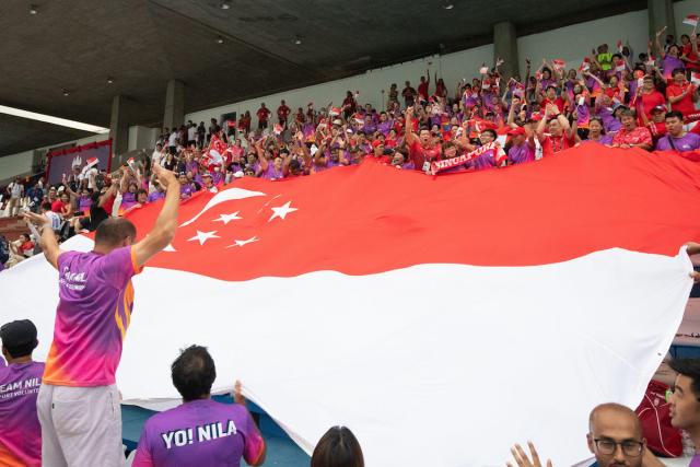 Singapore Team Nila sports volunteers turning out in support of the water polo team at the 2023 SEA Games. (PHOTO: SNOC/Lim Weixiang)