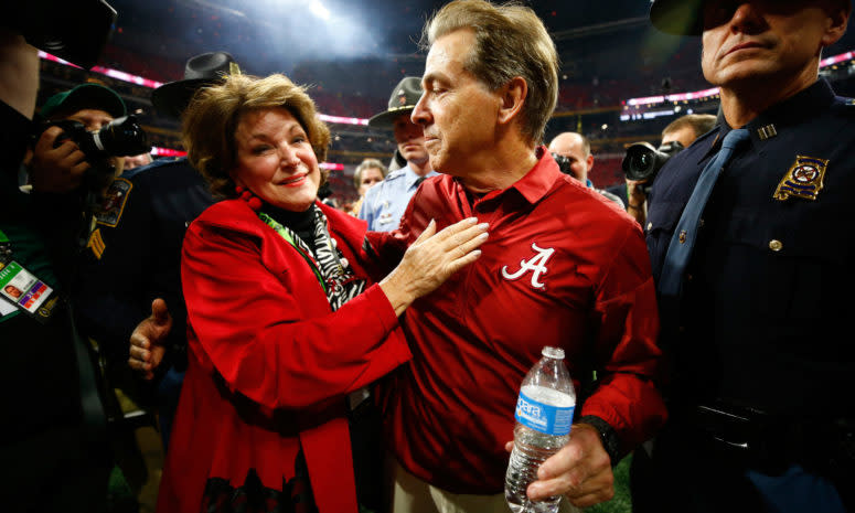 Head coach Nick Saban of the Alabama Crimson Tide celebrates with his wife Terry after beating the Georgia Bulldogs.