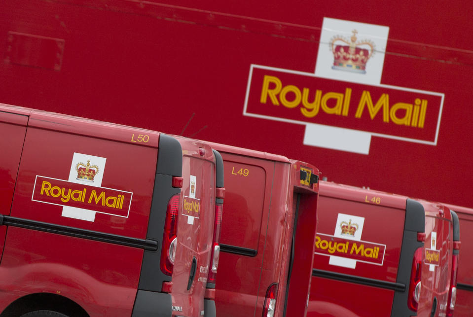 Royal Mail vans lined up at London's largest sorting office Mount Pleasant, Thursday, Sept. 12, 2013. The U.K. coalition government has confirmed plans to privatize the country's 500-year-old Royal Mail this fall. Business Secretary Vince Cable said Thursday an initial public offering of a majority stake in the postal service was scheduled for the coming weeks. (AP Photo/Alastair Grant)