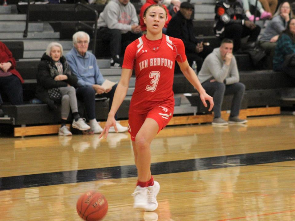 New Bedford's Lexi Thompson dribbles down court during a non-league game against Taunton.