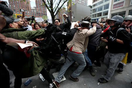 Demonstrators clash with people opposing their rally during a May Day protest in Union Square in New York City, U.S. May 1, 2017. REUTERS/Mike Segar