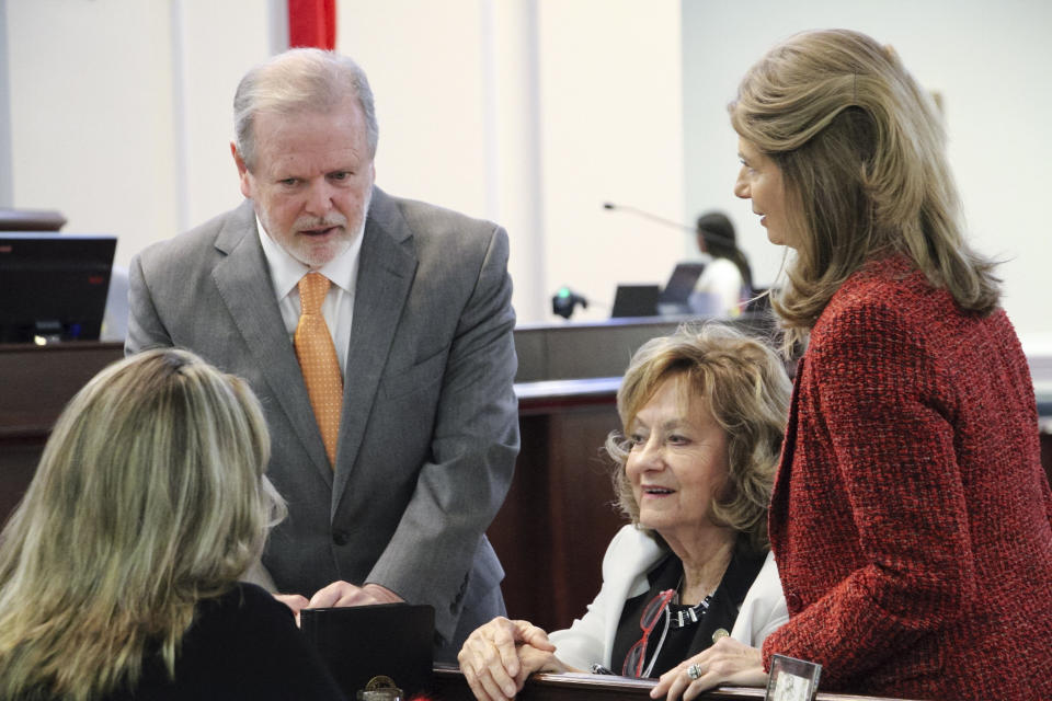 North Carolina Senate leader Phil Berger speaks with fellow Republican Sens. Amy Galey, left, Joyce Krawiec, center, and Lisa Barnes on the Senate floor in Raleigh, N.C., before the chamber votes on new abortion restriction, Thursday, May 4, 2023. (AP Photo/Hannah Schoenbaum)