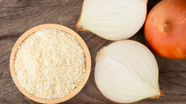 Onion powder in wooden bowl