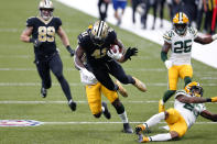 New Orleans Saints running back Alvin Kamara (41) is tackled by Green Bay Packers strong safety Adrian Amos on a 49 yard run in the first half of an NFL football game against the Green Bay Packers in New Orleans, Sunday, Sept. 27, 2020. (AP Photo/Brett Duke)