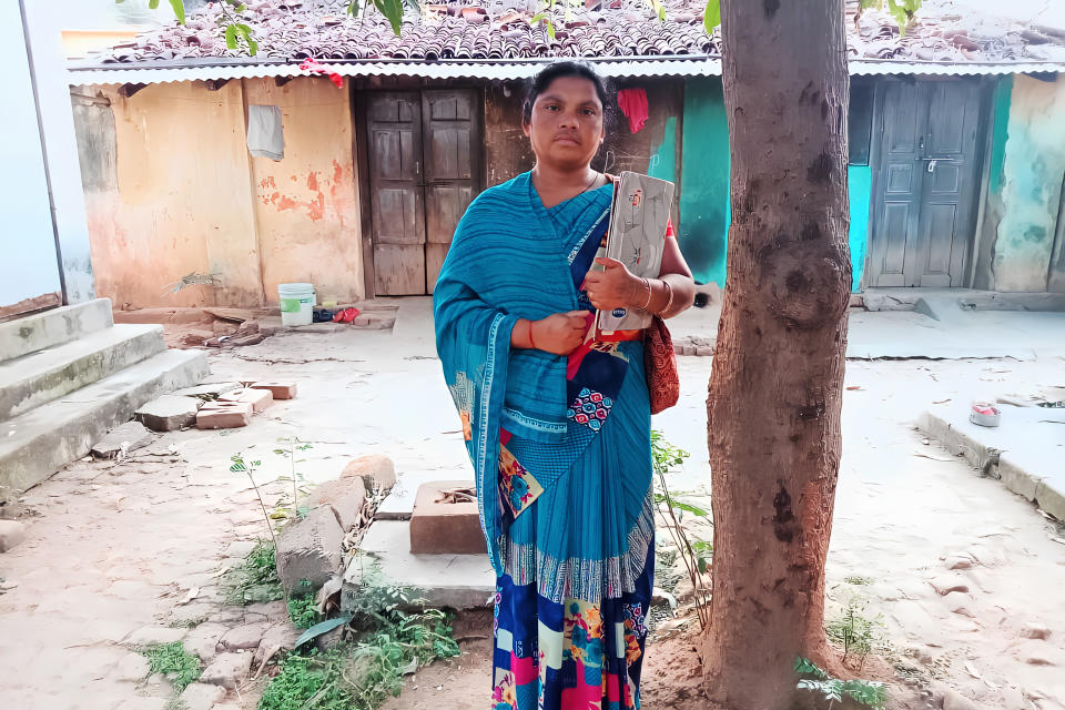 Sharada standing outside her house in Jurakhaman, Kalahandi in Odisha (Suchitra / NBC News)