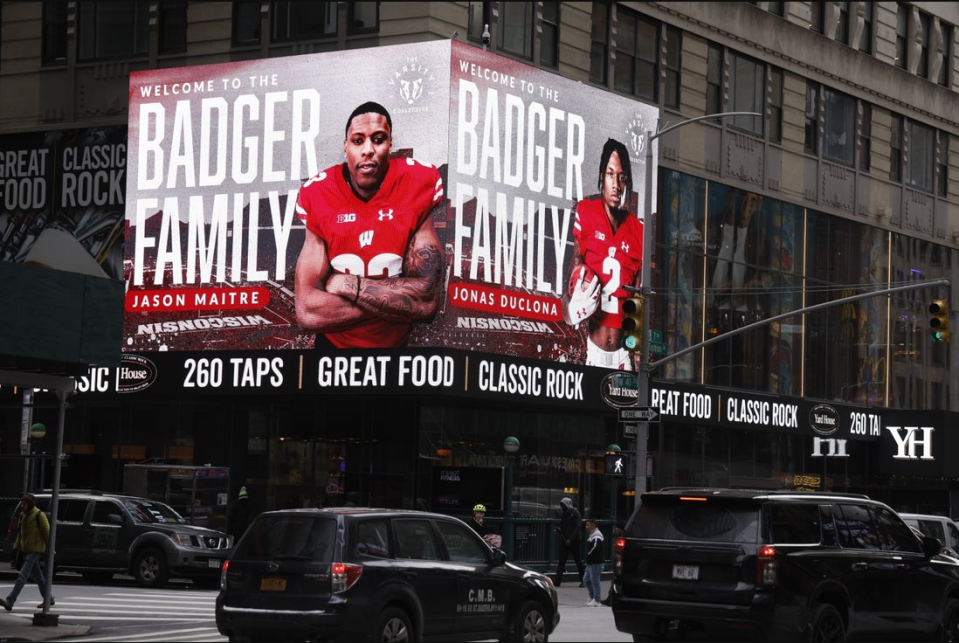 NEW YORK, NEW YORK - FEBRUARY 01: Naples defensive back Jonas Duclona, now signed with Wisconsin, was a part of an NIL collective that featured Wisconsin signees in Times Square.